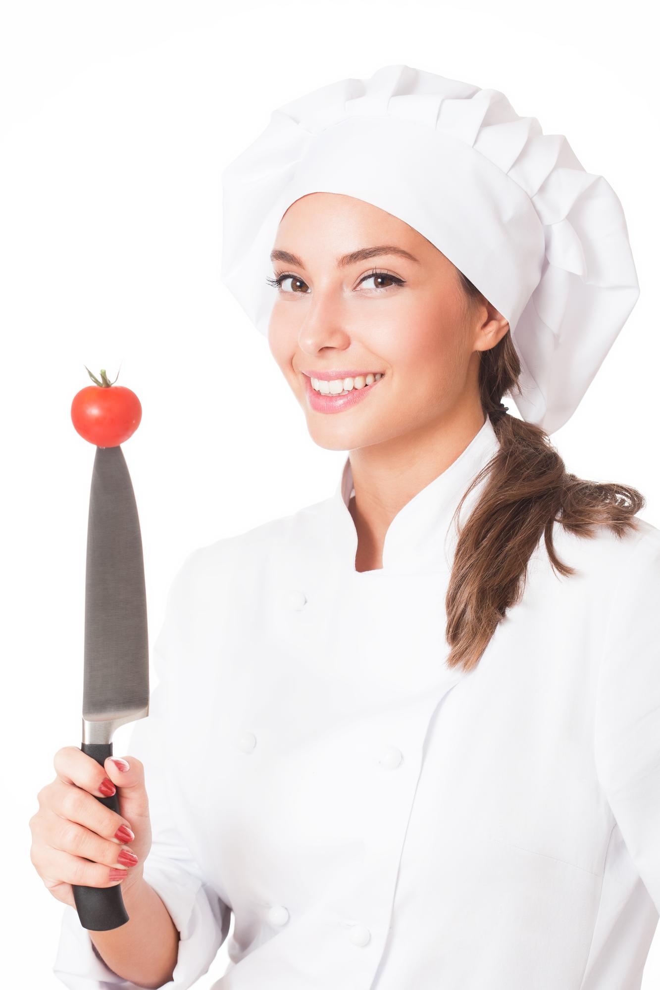 Instructor teaching knife skills in a calm kitchen