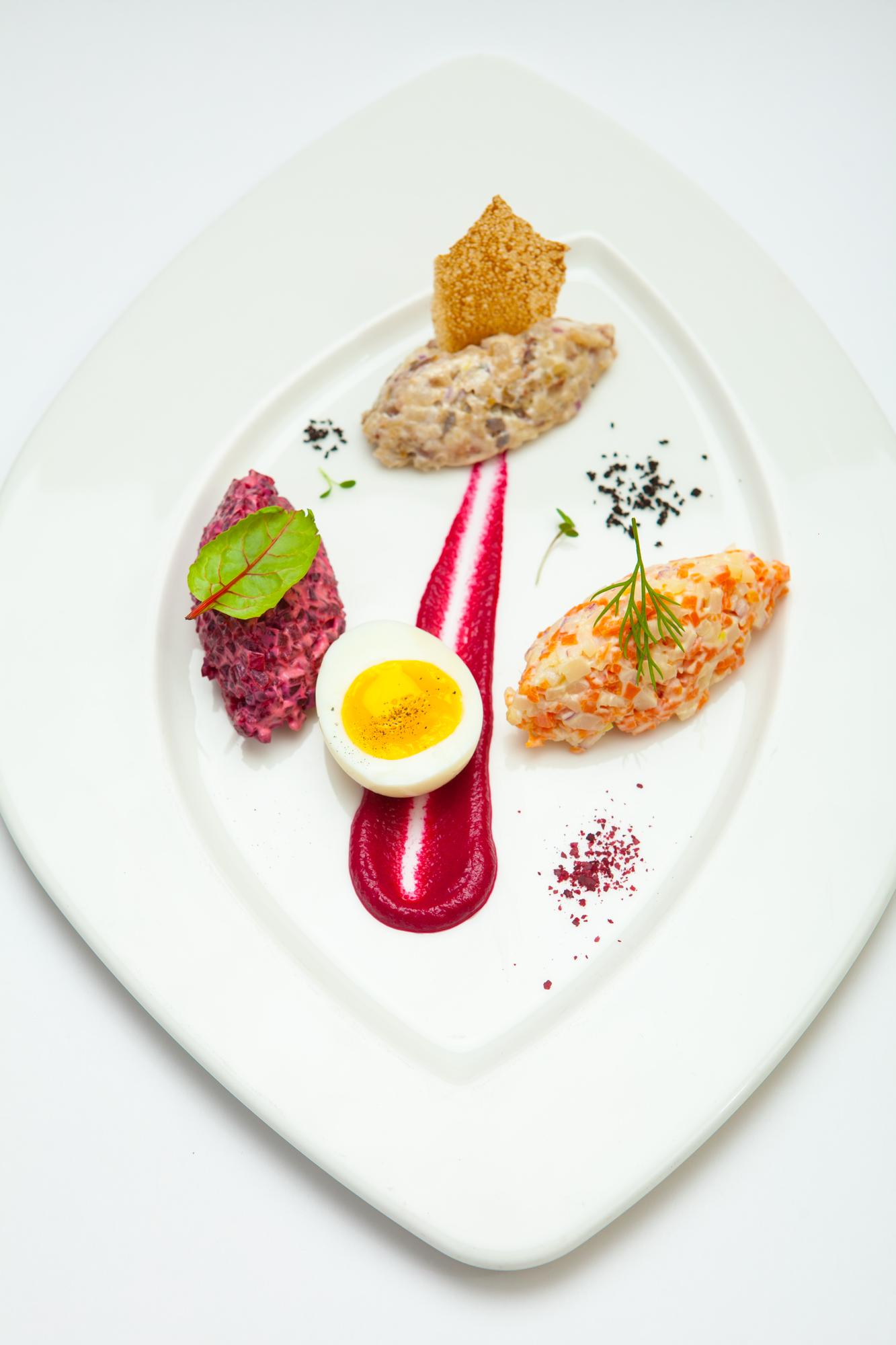 Chef plating a colorful dish